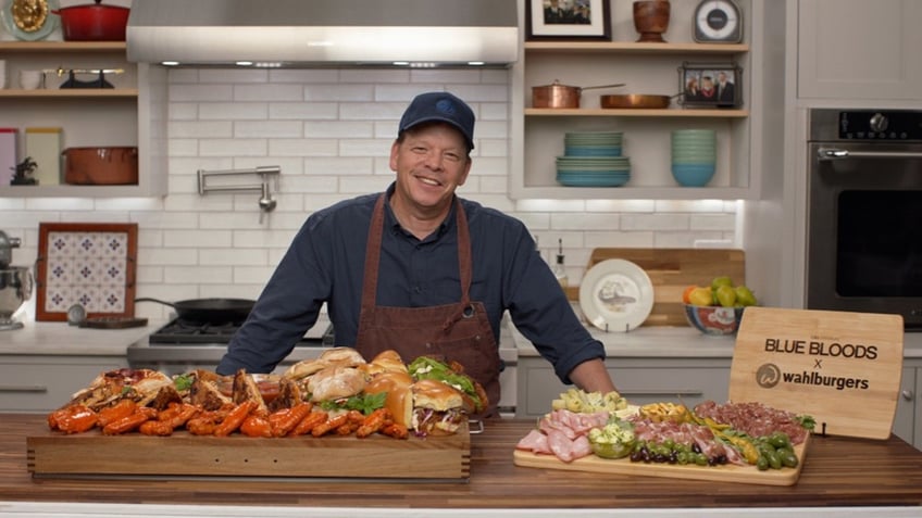 Paul Wahlberg poses with his smorgasbord created for the series finale of "Blue Bloods."