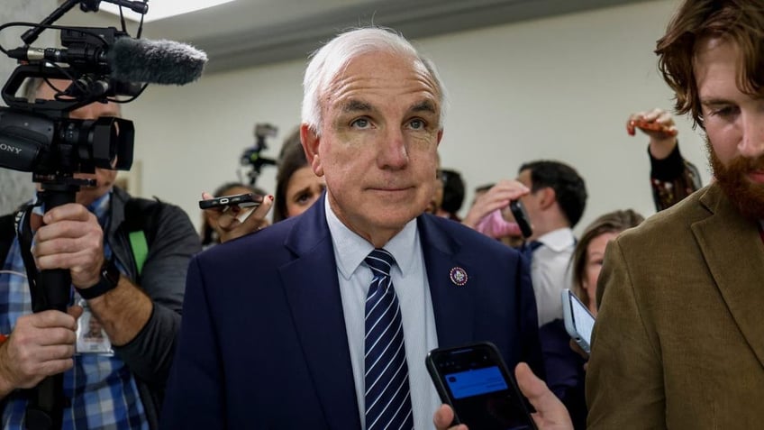 Rep. Carlos Gimenez speaks to reporters