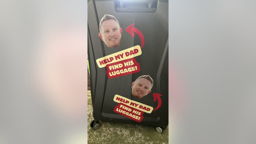 Luggage with face stickers