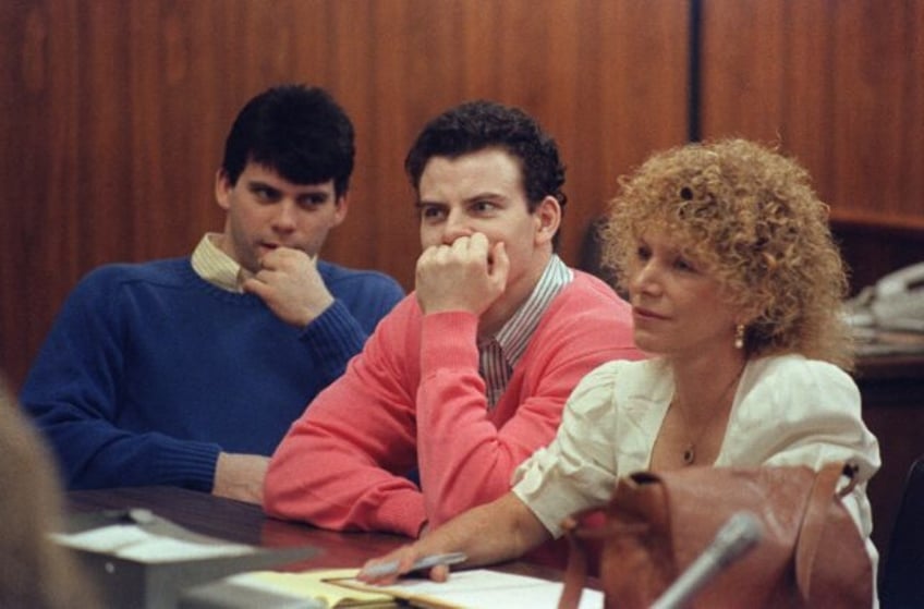 Erik Menendez (C) and his brother Lyle are asking a judge to reduce the life sentences the