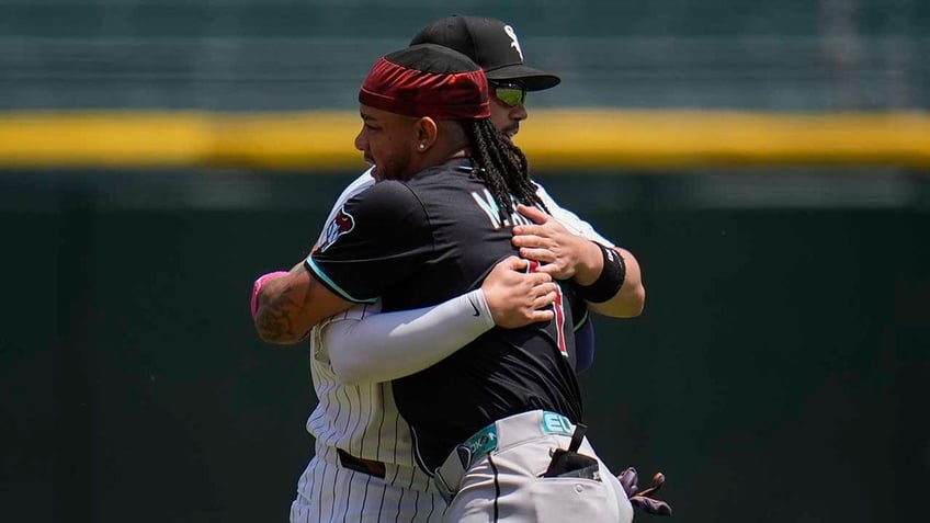Miguel Vargas hugs Ketel Marte