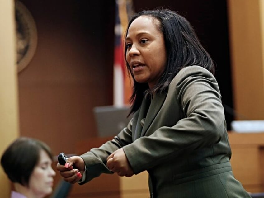 Fulton County deputy district attorney Fani Willis gestures as she makes her closing arguments during a trial for Martin Blackwell in Atlanta, Wednesday, Aug. 24, 2016. Blackwell is accused of pouring hot water on two gay men as they slept. (AP Photo/John Bazemore)