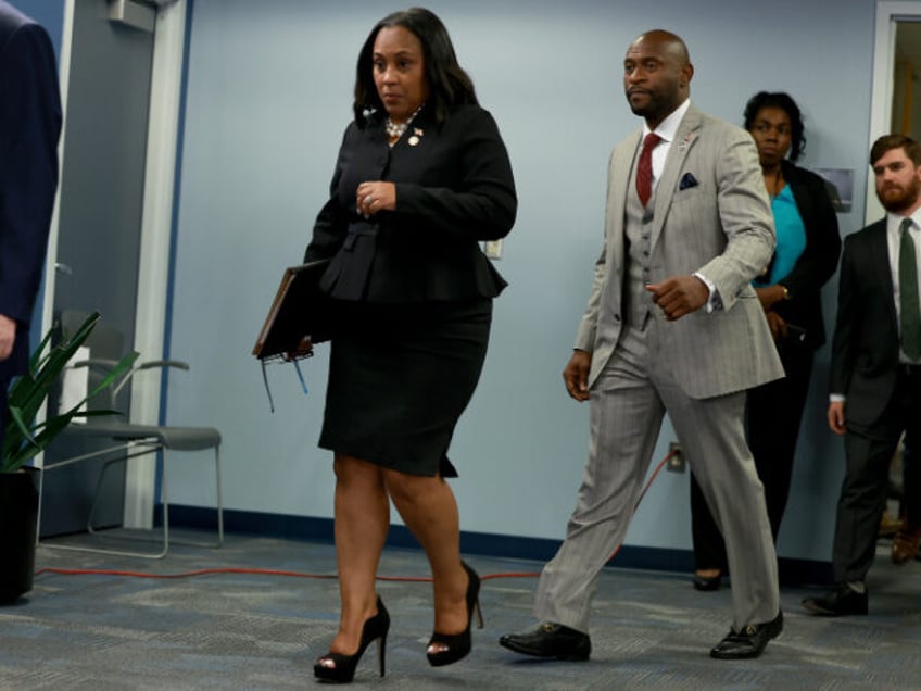 TLANTA, GEORGIA - AUGUST 14: Fulton County District Attorney Fani Willis arrives to speak at a news conference at the Fulton County Government building on August 14, 2023 in Atlanta, Georgia. A grand jury today handed up an indictment naming former President Donald Trump and his Republican allies over an …