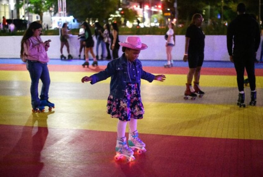 A girl skates during a listening party for Beyonce's new album "Cowboy Carter" at an outdo