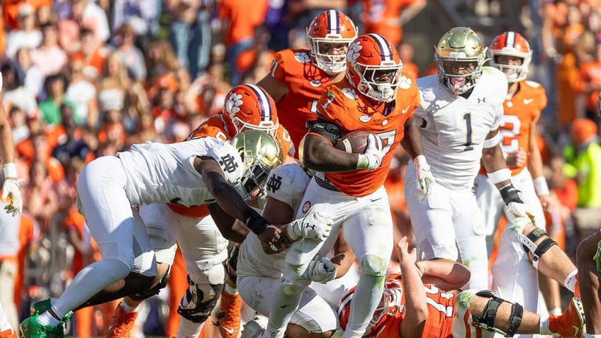 fans storm the field after clemson pulls off upset of notre dame in thriller