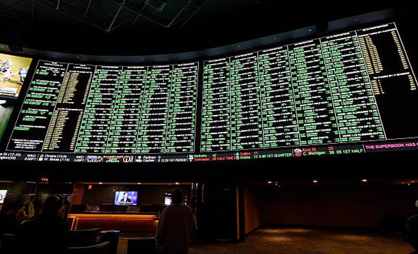 The betting line and some of the nearly 400 proposition bets for Super Bowl 50 between the Carolina Panthers and the Denver Broncos are displayed at...