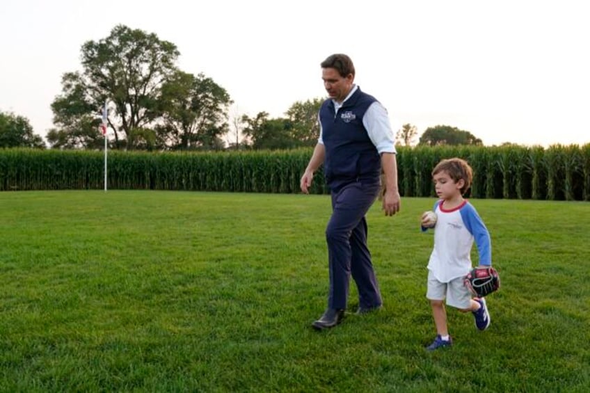 far away from trumps jail drama ron desantis and his family head to iowas field of dreams