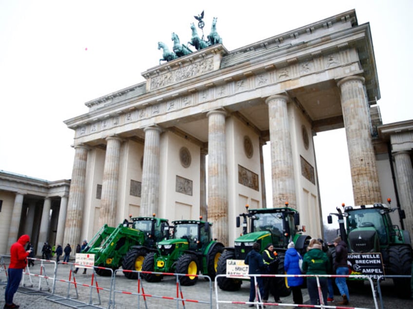 BERLIN, GERMANY - JANUARY 15: Tractors of protestors stand in front of Brandenburg gate during a large-scale demonstration on January 15, 2024 in Berlin, Germany. Farmers have been protesting across Germany for over a week against proposed government measures that would reduce federal benefits for the agricultural sector. While the …