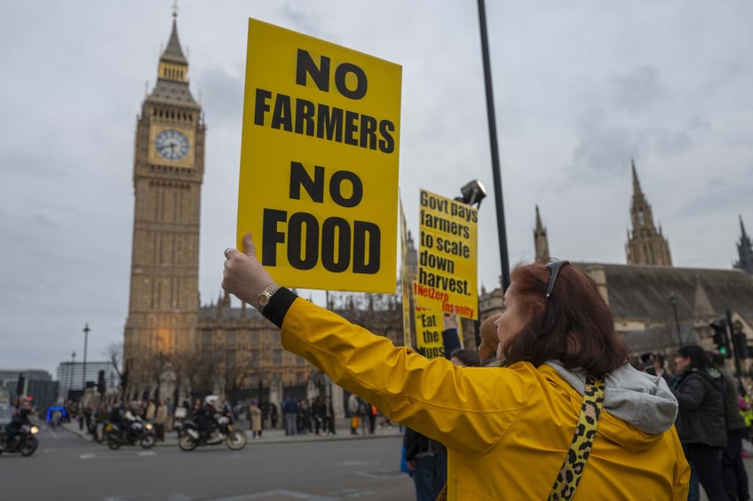 LONDON, ENGLAND - MARCH 25: Farmers holding banners and placards and driving tractors gather at Parliament Square during a demonstration organised by Save British Farming against UK food policy, substandard imports and stricter food labelling regulations, as they call for the government to act to save British farming, in central London, United Kingdom on March 25, 2024. (Photo by Rasid Necati Aslim/Anadolu via Getty Images)