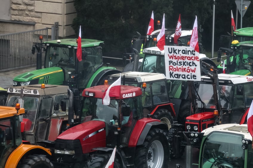 POZNA, POLAND - 2024/02/09: Farmers from the Greater Poland region drive their tractors as they block Aleja Niepodleglosci road during the nationwide farmers' strike. The protest in Poland is part of the European farmers' protest against the EU Green Deal regulations. Polish farmers also demand a change to the EU agreement with Ukraine regarding the import of agricultural produce to the EU. The protest in Pozna, the capital of Greater Poland, was organised by Rola Wielkopolska. Over a thousand tractors blocked roads in the city. (Photo by Dominika Zarzycka/SOPA Images/LightRocket via Getty Images)