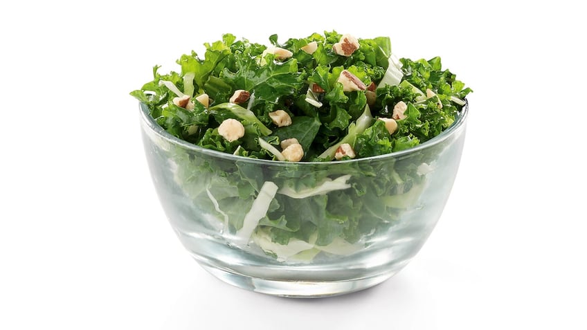 A kale salad from Chick-fil-A is shown on a white background.