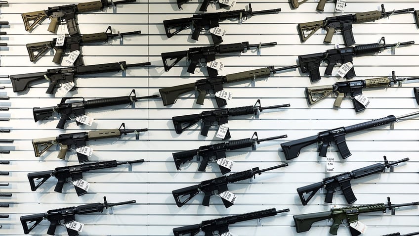 An assortment of semiautomatic rifles on display for sale at R Guns in Carpentersville, Illinois, on April 29, 2023.