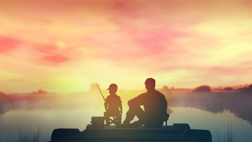 Father with son in the morning fishing