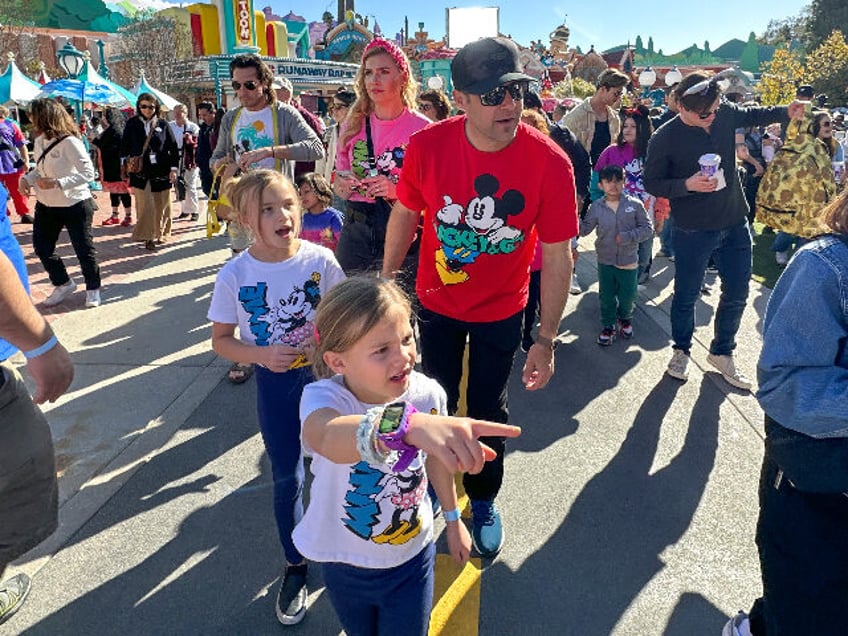 Anaheim, CA - March 18: Rory Pettit points out things as she enters Mickey's Toontown