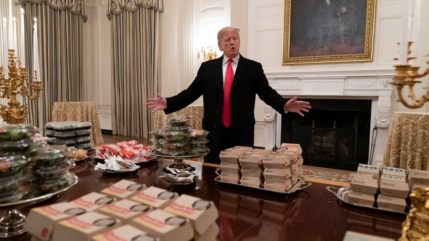 President Donald Trump presents fast food to be served to the Clemson Tigers football team at the White House on Jan. 14, 2019, in Washington, D.C.