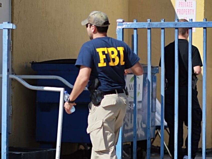 MIAMI - OCTOBER 21: An agent with the F.B.I. is seen outside the American Therapeutic Corp