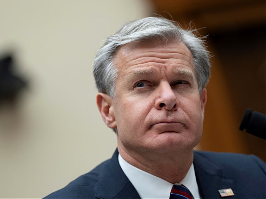 FBI Director Christopher Wray appears before the House Judiciary Committee on Capitol Hill in Washington, DC, on July 24, 2024. The gunman who attempted to assassinate Donald Trump at a campaign rally searched online for details about the November 1963 shooting of US president John F. Kennedy in the days before the attack, the FBI director said. FBI chief Christopher Wray, testifying before a congressional committee, also said the gunman flew a drone over the area where the former president was scheduled to speak about two hours before he took the stage. (Photo by Chris Kleponis / AFP) (Photo by CHRIS KLEPONIS/AFP via Getty Images)