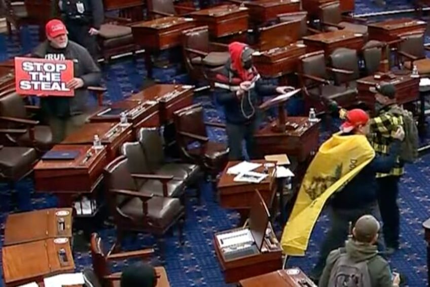 fbi man wearing captain america backpack stole items from senators desks during capitol riot