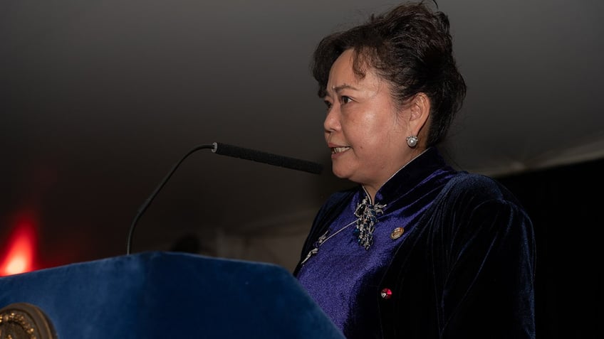 Winnie Greco speaks at a reception celebrating the Mid-Autumn Moon Festival