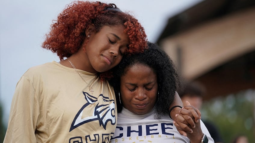 People attend a vigil at Jug Tavern Park following a shooting at Apalachee High School