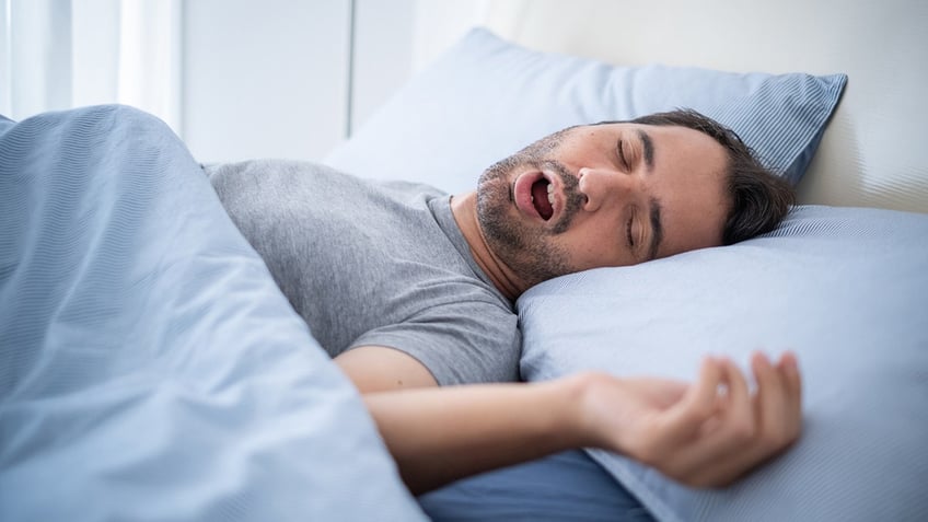 man snoring while sleeping