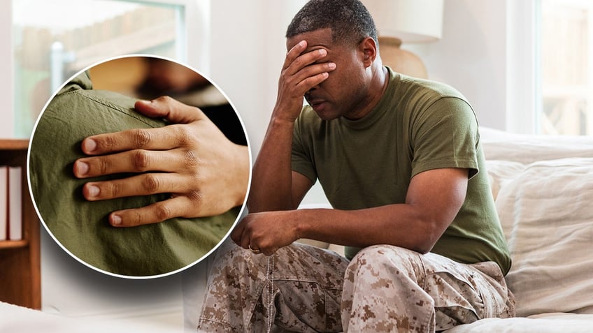 A photo displaying a hand on someone's shoulder, with a picture of a distraught solider in the background