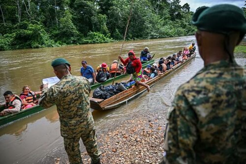 fearing new panama president will block key route to us migrants flood darien gap