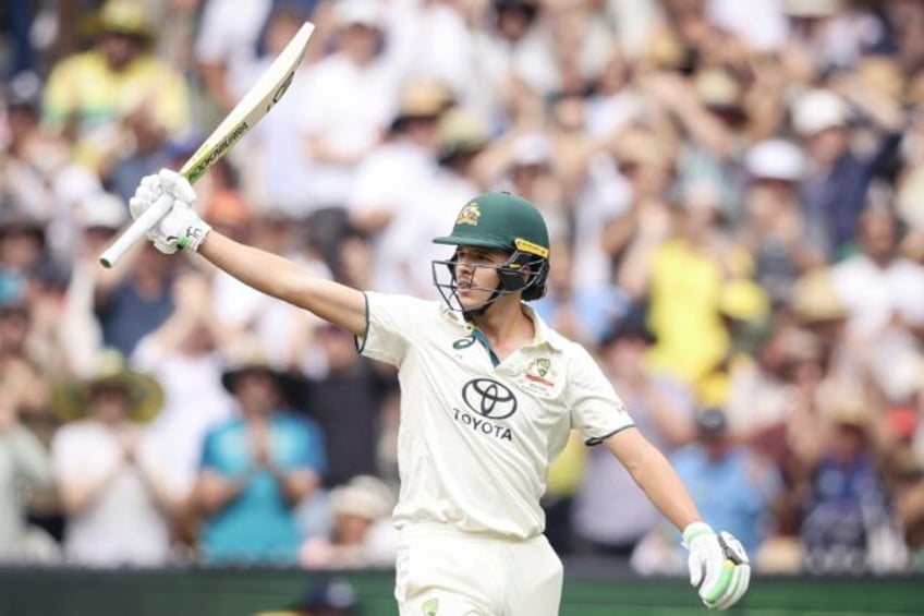 Australia's Sam Konstas raises his bat after passing 50 on day one of the fourth Test agai