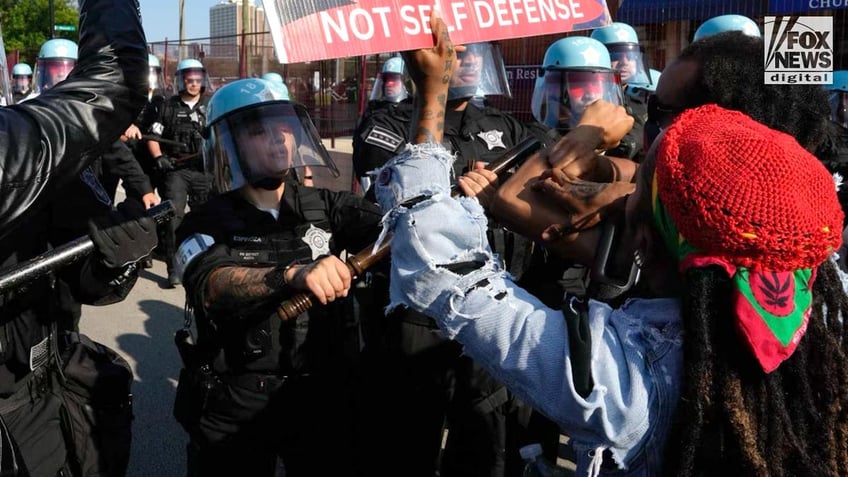 Protestors clash with police in Chicago outside of the DNC