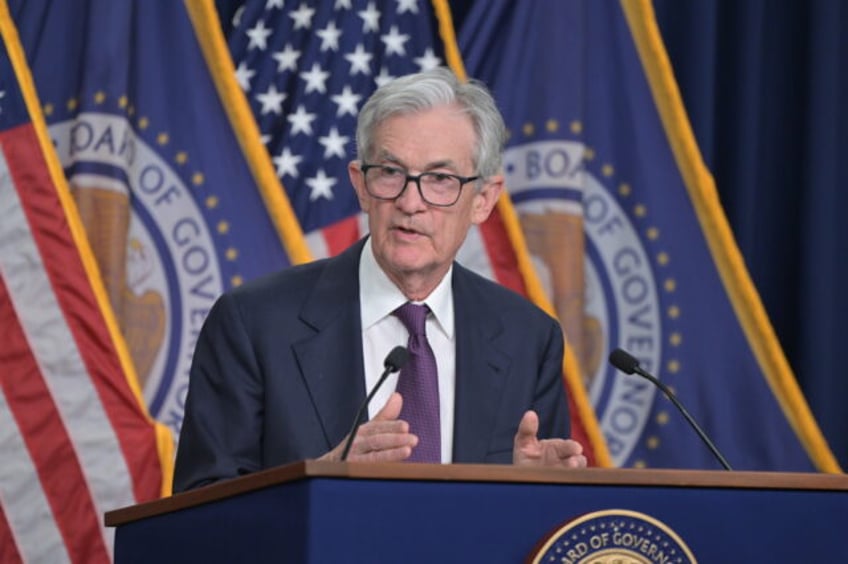 Chair Powell answers reporters' questions at the FOMC press conference on December 18