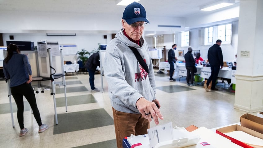 A voter casts his ballot on Election Day in D.C. 