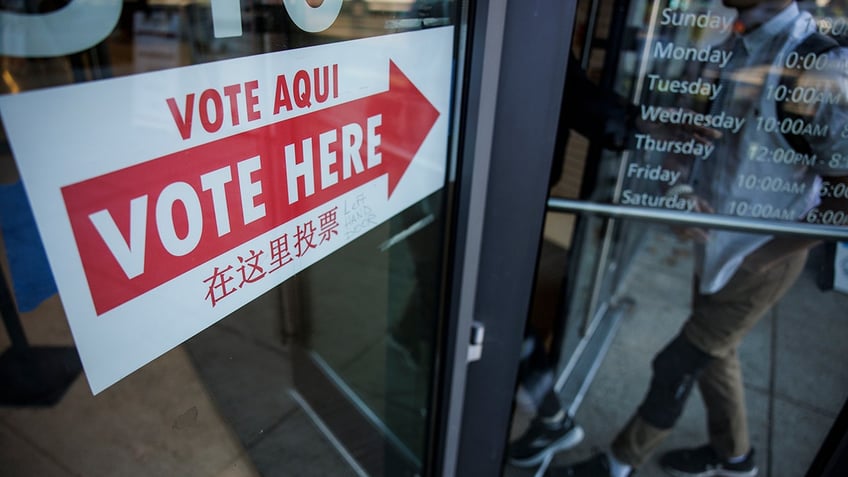 A "vote here" sign at a DC polling place