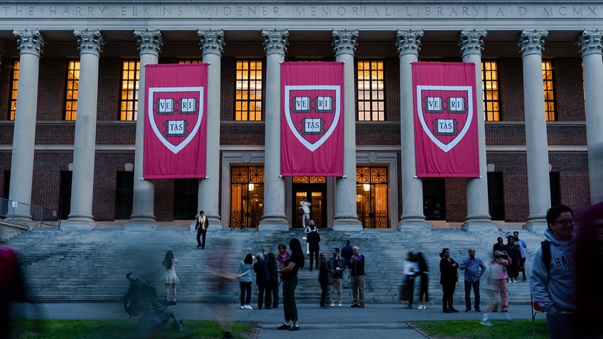Harvard University banners hang in May 2025