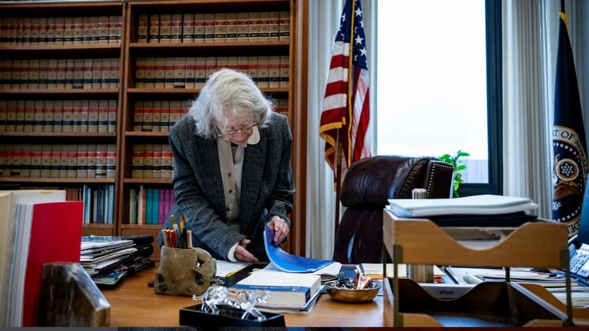 U.S. Circuit Judge Pauline Newman going through paperwork