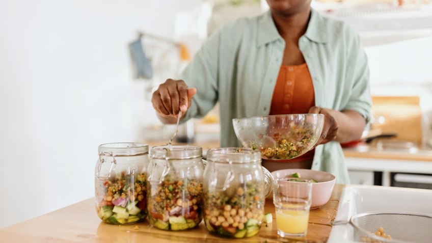 Woman preparing a nutritious meal in advance