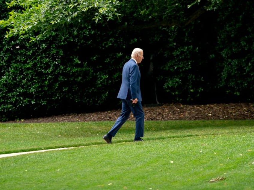 US President Joe Biden walks on the South Lawn of the White House, after disembarking Marine One in Washington, DC, on June 14, 2022. - Biden travelled to Philadelphia, Pennsylvania, to deliver remarks at the 29th AFL-CIO Quadrennial Constitutional Convention. (Photo by Stefani Reynolds / AFP) (Photo by STEFANI REYNOLDS/AFP via Getty Images)