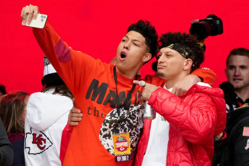 Jackson Mahomes and Patrick Mahomes of the Kansas City Chiefs celebrate on stage during the Kansas City Chiefs Super Bowl LVII victory parade on...