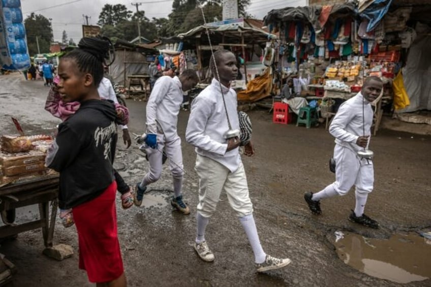 Tsavora Fencing Mtaani Club members head to training in Nairobi's Mathare informal settlem