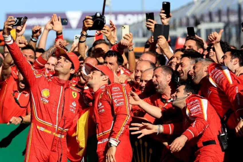 The Ferrari team celebrate a masterful one-two at the Australian Grand Prix