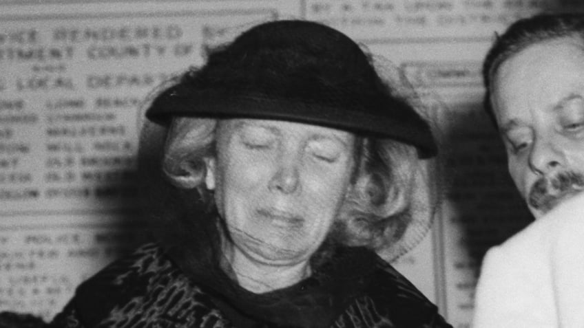 A close-up of Ann Woodward crying