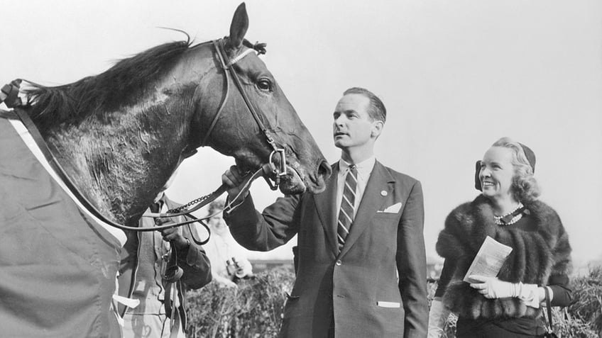William Woodward Jr. admiring his race horse