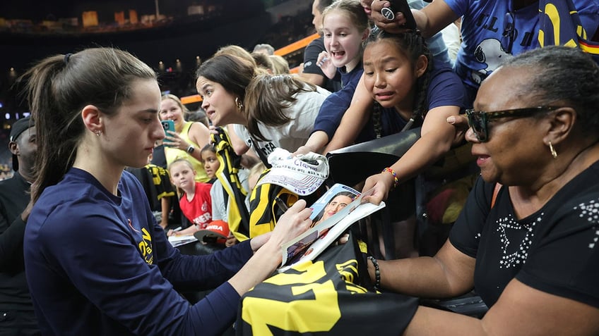 Caitlin Clark signs autographs