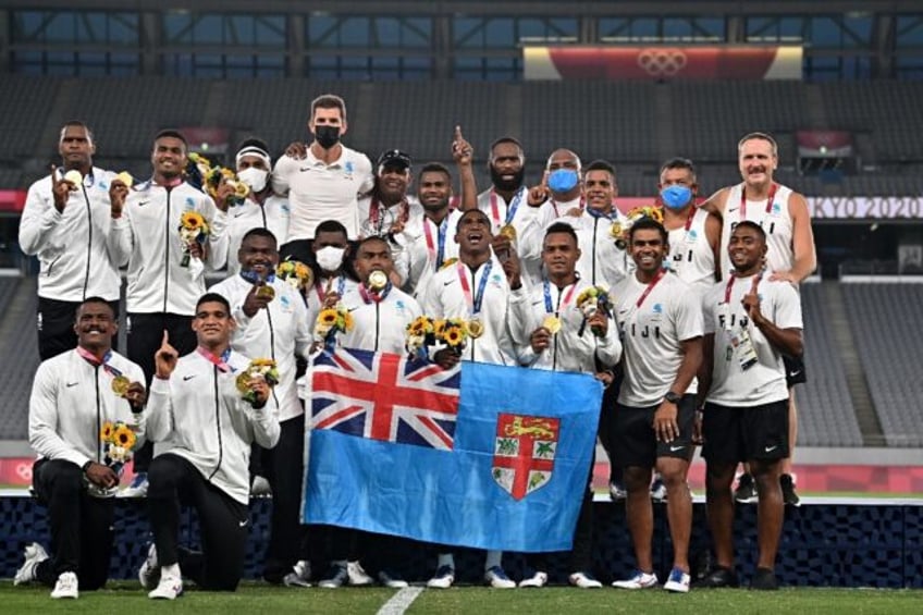 Fiji's rugby sevens players celebrate their gold in Tokyo