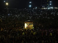 Filipino Catholics pray for good health and peace in huge procession venerating Jesus statue