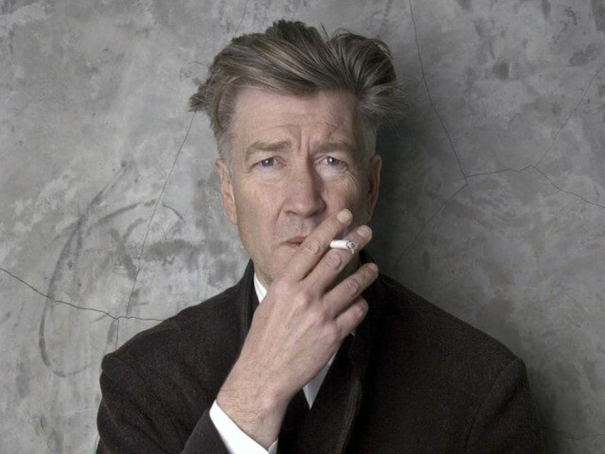 Filmmaker David Lynch poses at his Los Angeles home March 14, 2002. (AP Photo/Chris Weeks,