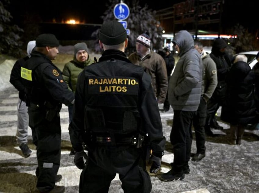 Finnish border guards explain of the closing of the border to a group of Russian-speaking men trying to cross the border from Finland to Russia at the prematurely closed Vaalimaa border check point between Finland and Russia in Virolahti, Finland on December 15, 2023. The check point was re-opened on …