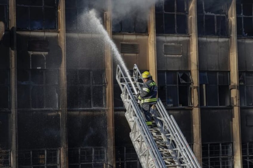 fire engulfs illegal johannesburg housing block killing 74