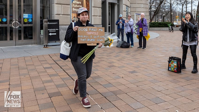 USAID workers leave HQ in DC after being laid off on the advice of DOGE