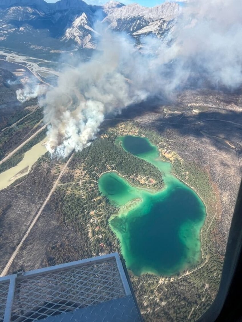 This August 3 2024 image obtained from the Jasper National Park in Canada, shows fire acti