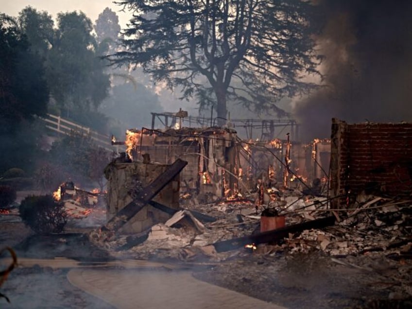 A home burns during the Mountain Fire in Camarillo, California, US, on Wednesday, Nov. 6,